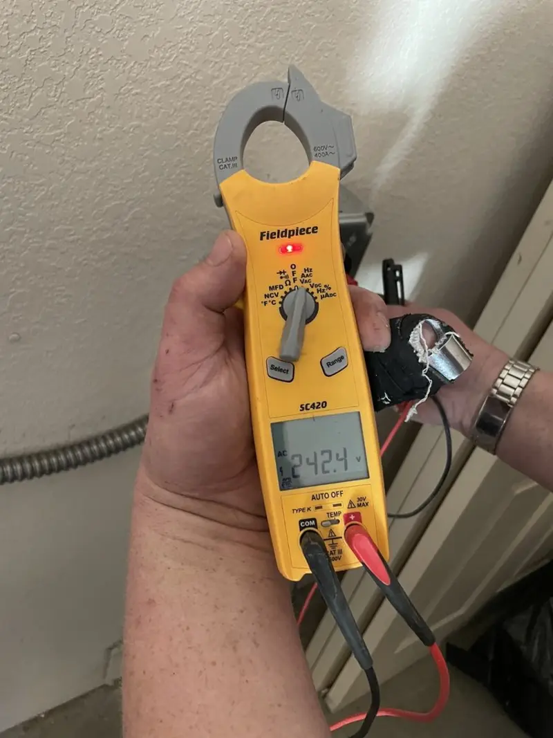 Voltage testing with clamp meter during Electrical Installation Services in Danville